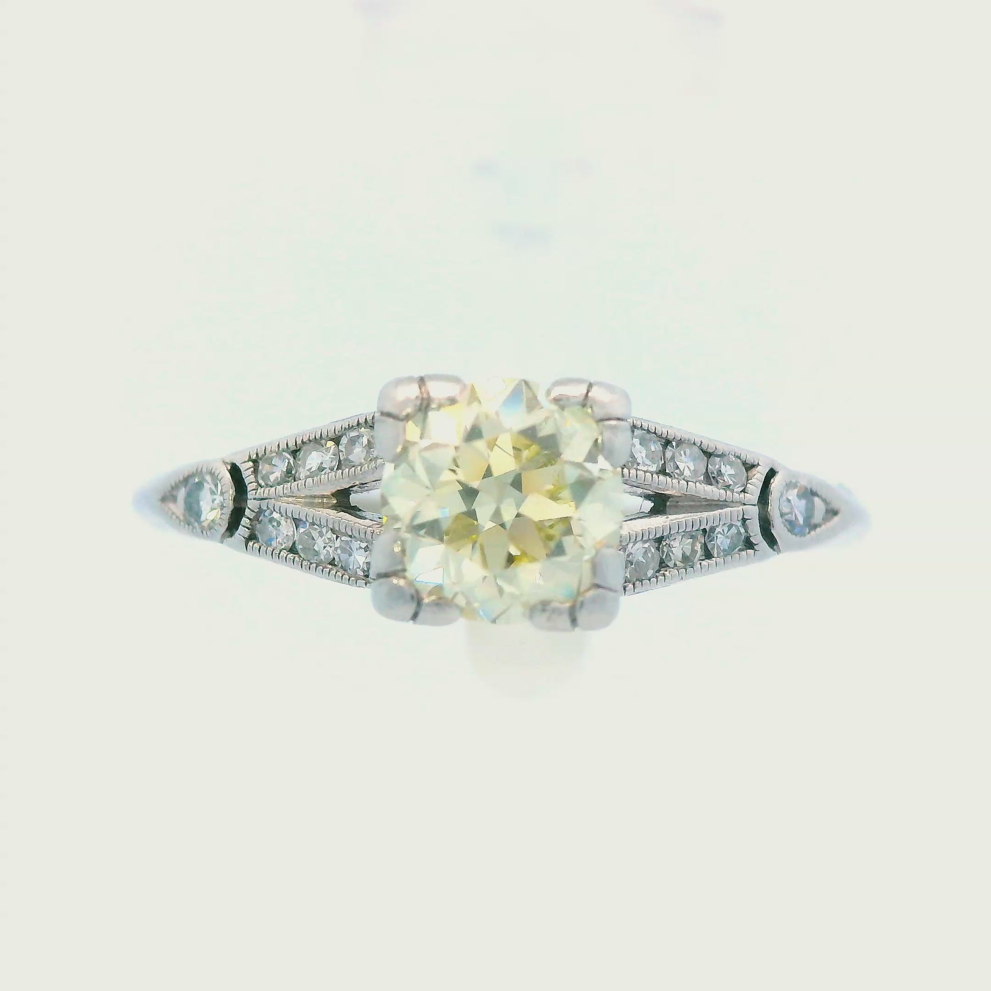 Art Deco Platinum and Fancy Yellow Diamond Engagement Ring