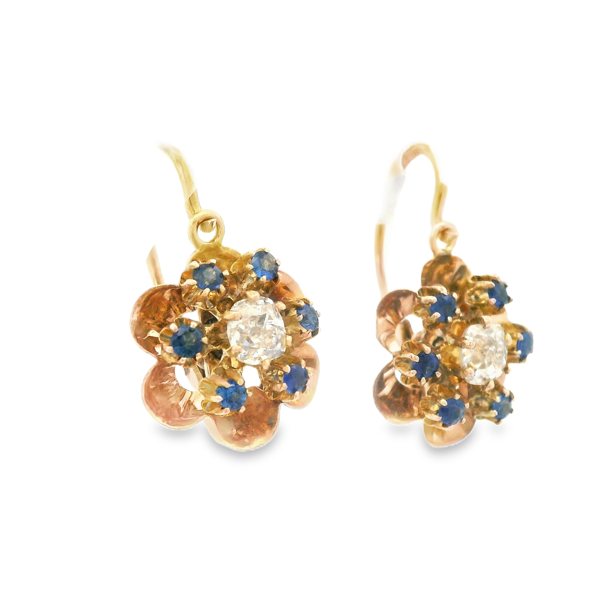 Side view of 1890 Victorian 14K rose gold flower drop earrings, featuring a delicate flower design with diamonds and sapphires that shimmer in the light.