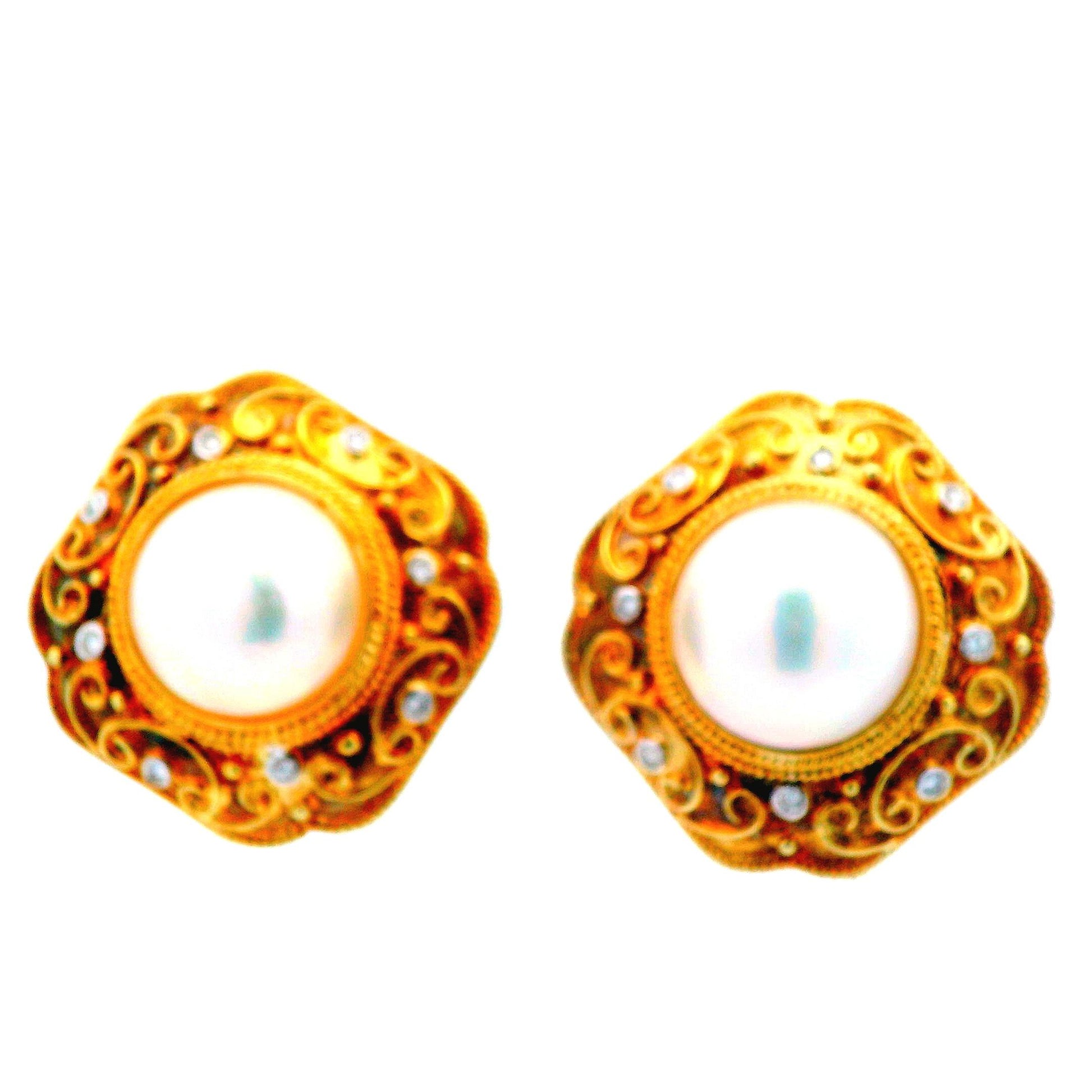 Front view of 14K yellow gold earrings featuring 14.5mm Mabe pearls surrounded by sparkling diamonds, designed for luxury and elegance, in Lexington, Kentucky