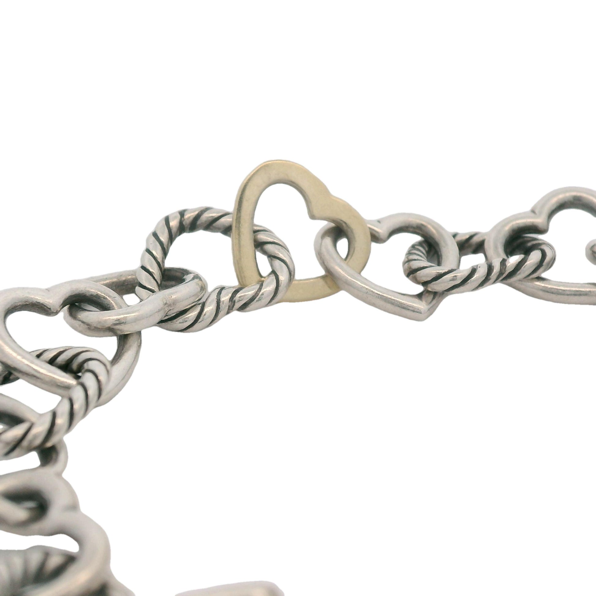 Side view of David Yurman Heart Toggle Bracelet showing the smooth transition between sterling silver and 18K gold.