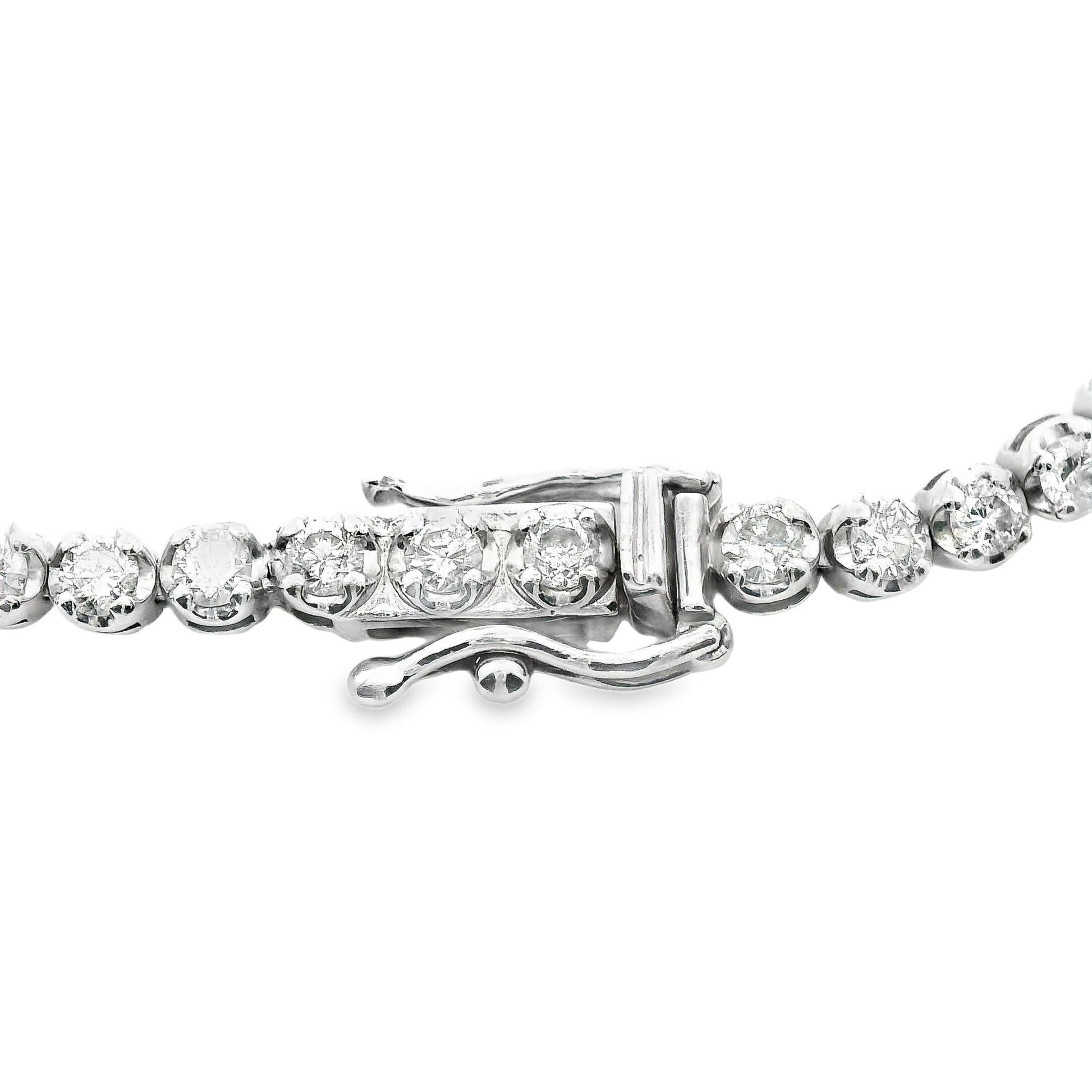 Detailed close-up of the 14K white gold tennis bracelet’s design, featuring perfectly aligned diamonds set in a sleek, polished band for ultimate luxury.
