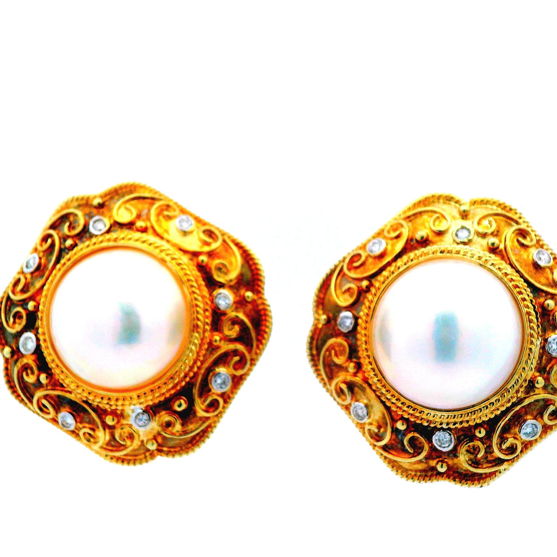 Detailed view of the 14K yellow gold Mabe pearl earrings, featuring 14.5mm pearls and diamonds, showcasing their classic and sophisticated design.