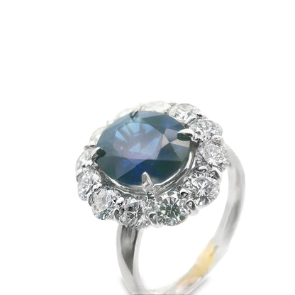 Top-down view of the 14K white gold Lady Di ring with blue sapphire center stone and diamond halo, showcasing its stunning symmetry and craftsmanship